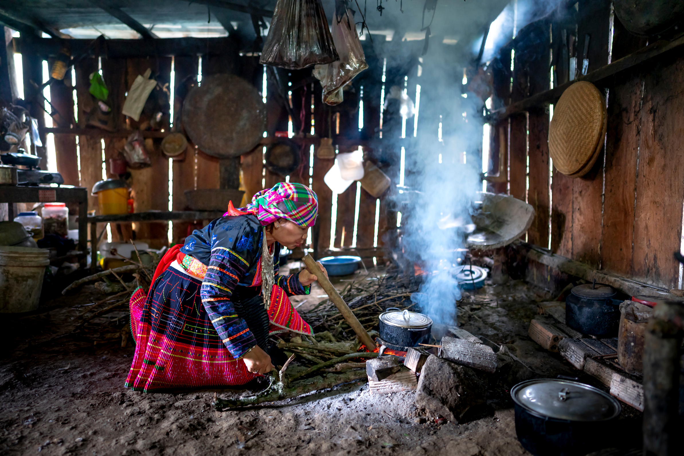 Focused woman cooking on fire